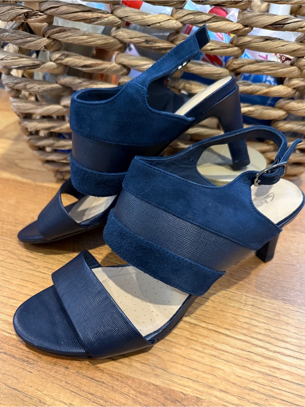 Women's 7.5 Clarks navy suede and leather adjustable ankle strap high heels.